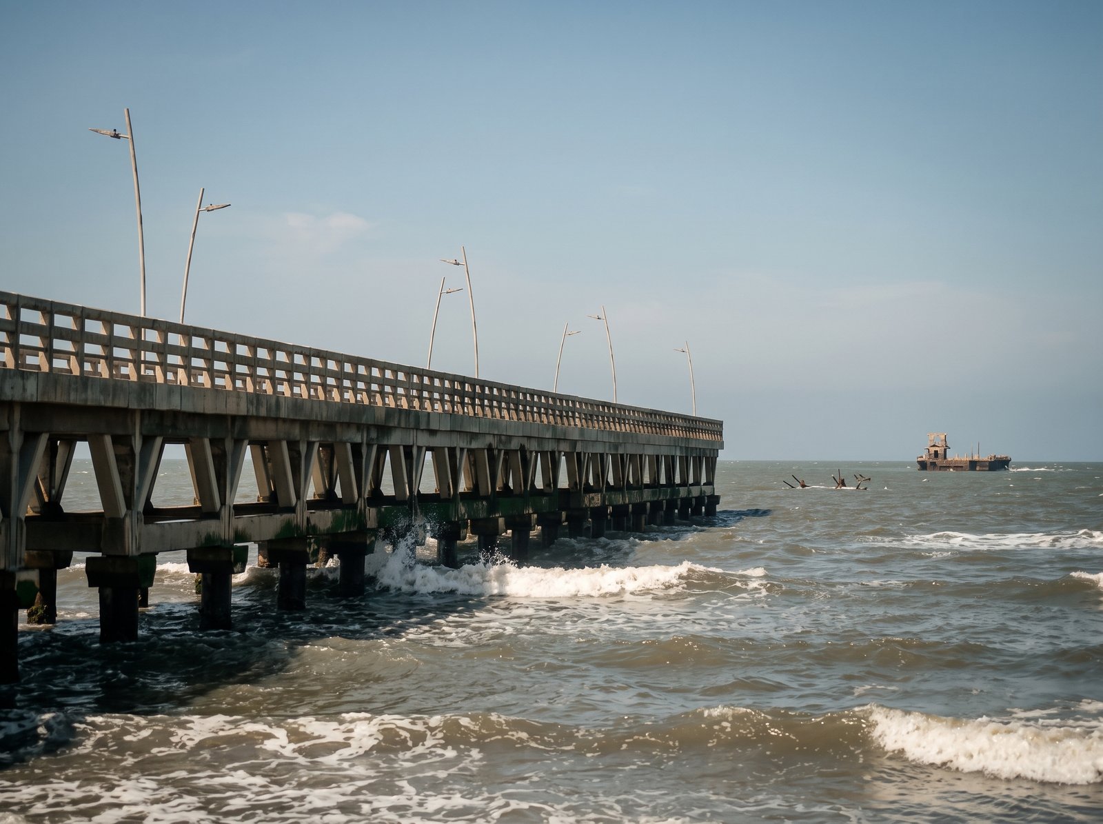Reconstructed pier of Puerto Colombia and Immigrants Plaza at sunset